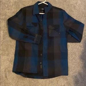 Men’s blue plaid VANS official gear.